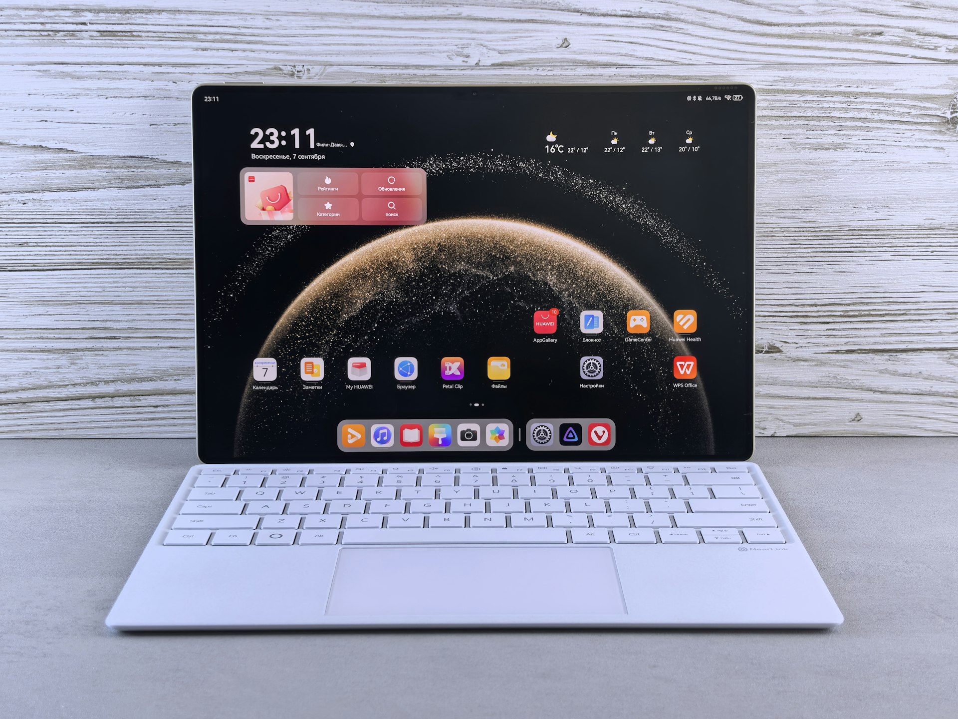 A modern tablet with a white keyboard attachment.